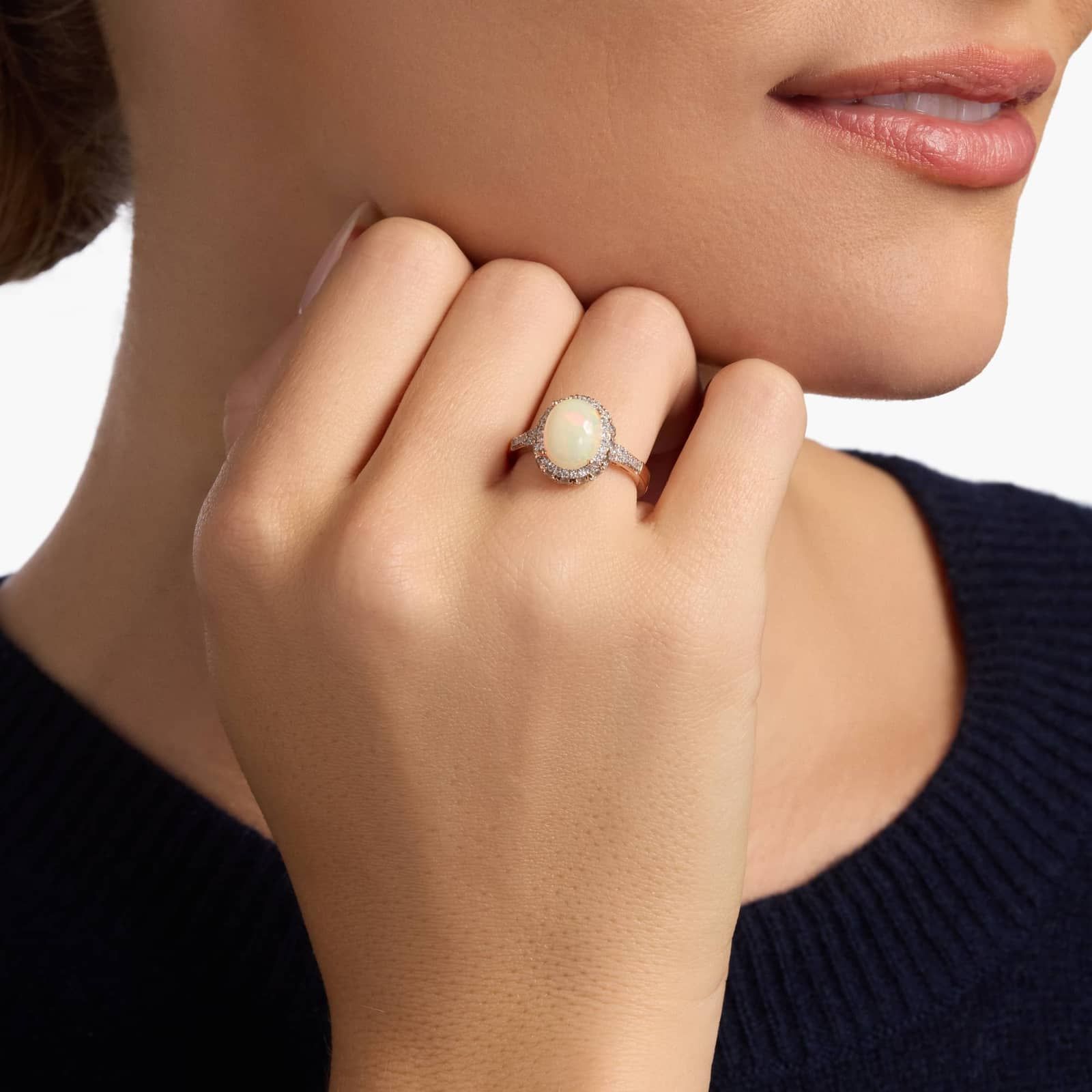 Oval Opal and Swiss Blue Topaz Halo Ring in 14k Rose Gold 4