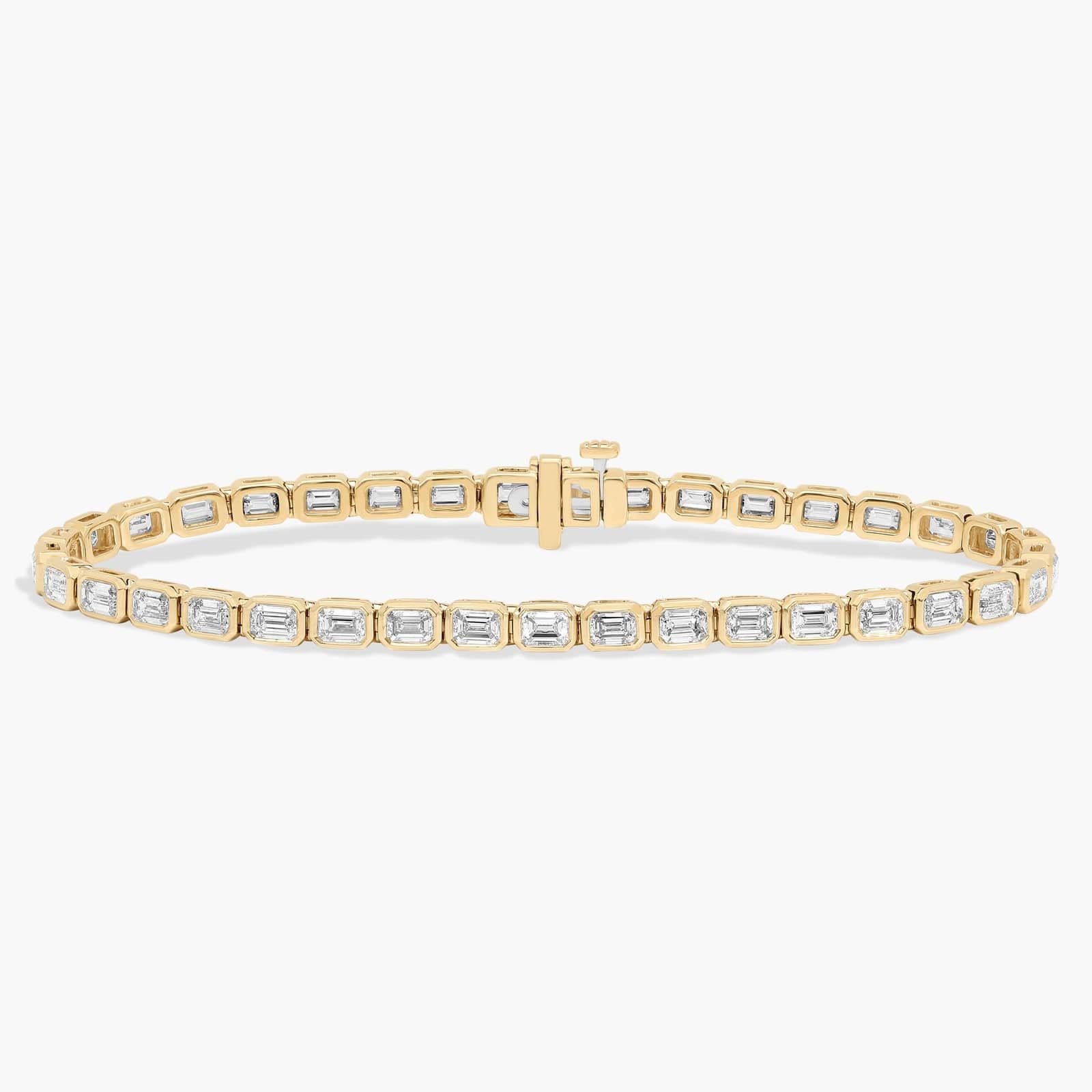 7 " Emerald Cut Lab Grown Diamond E/W Bezel Set Tennis Bracelet In 14K Yellow Gold (5 Ct. tw. - F-G / VS2-SI1)