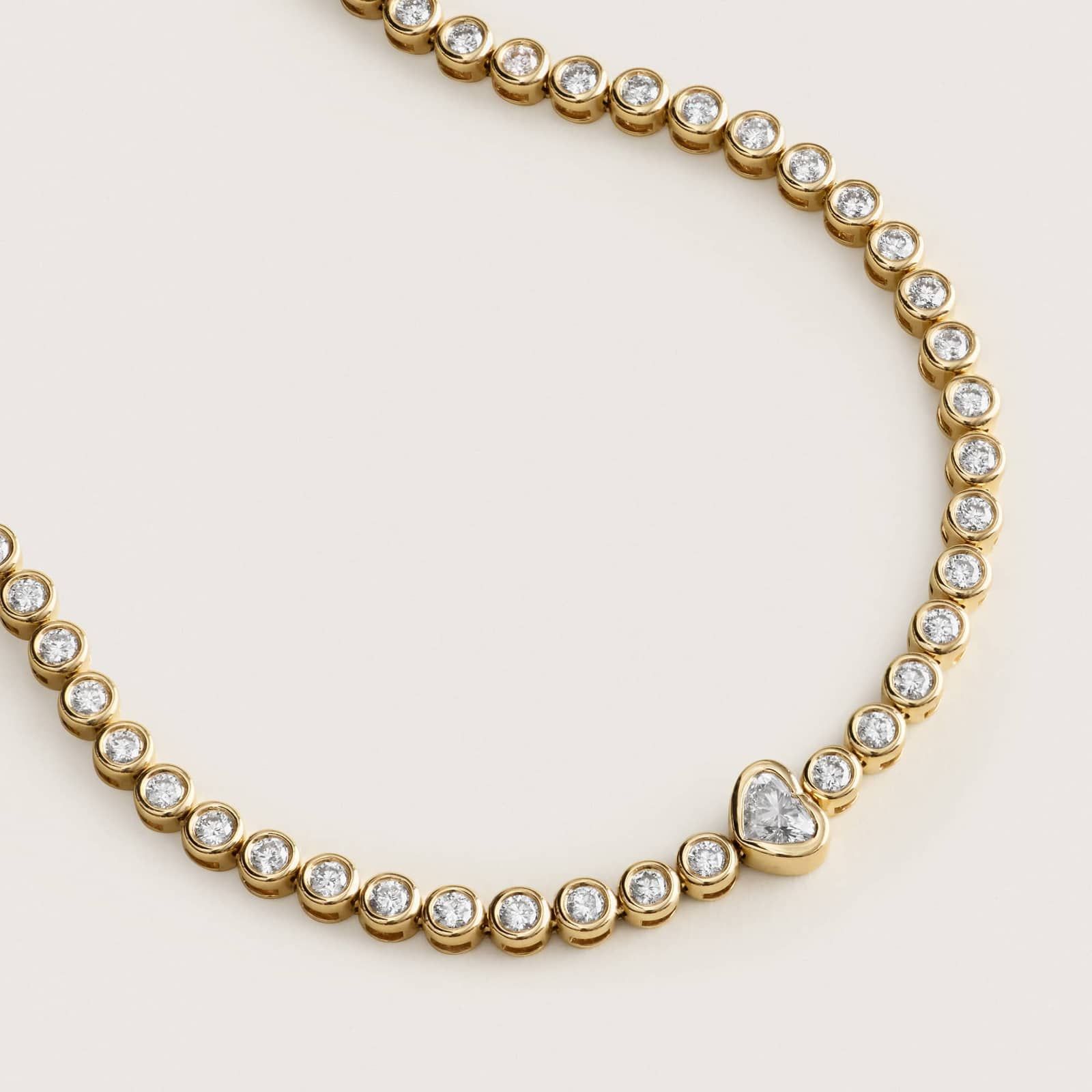 Round Diamond Tennis Bracelet with Bezel Heart Center in 14K Yellow Gold 2